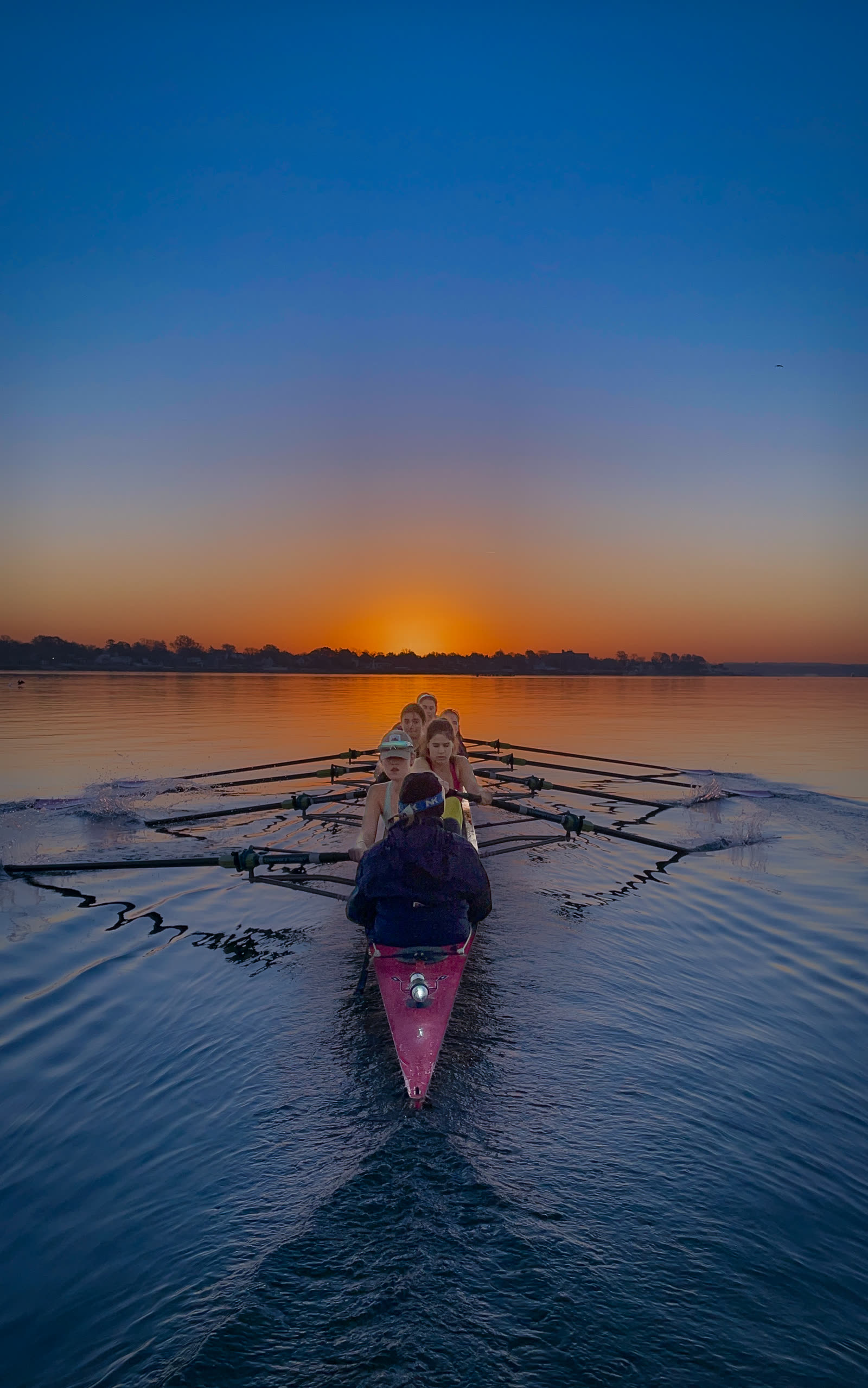 A sculler heading out at dawn