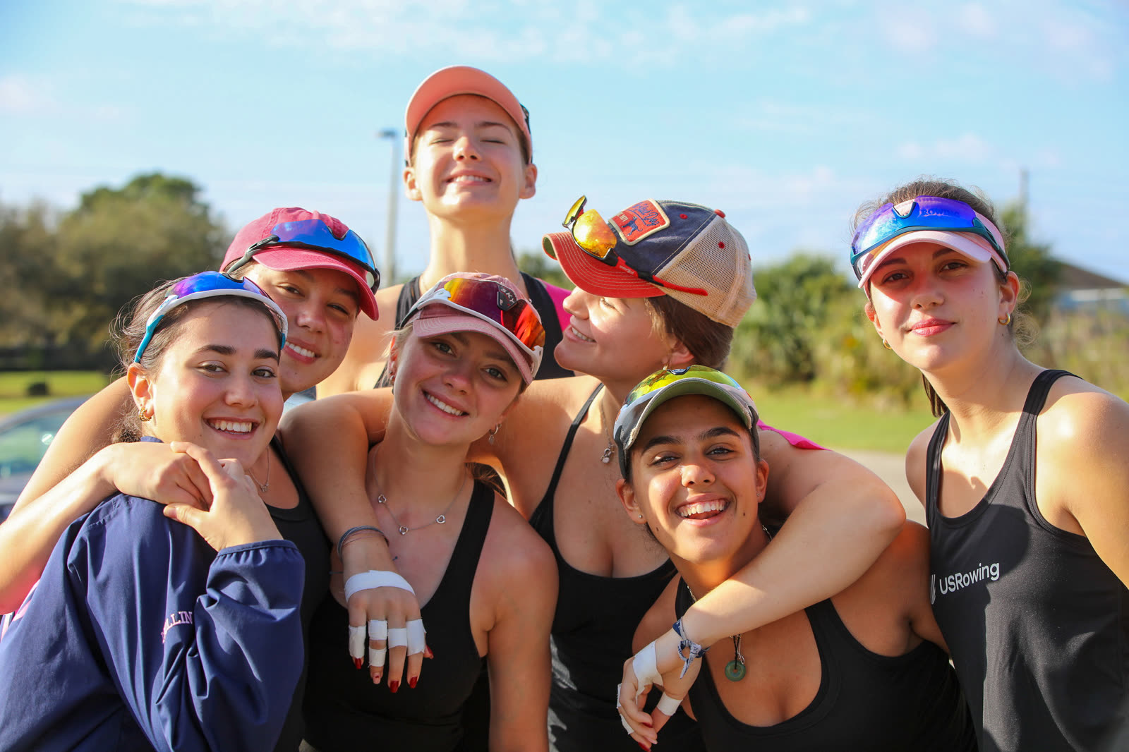 City Island Rowing athletes arm in arm after practice