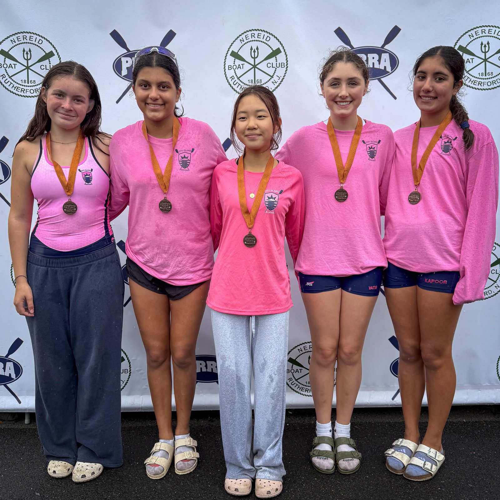 The MS 4+ with their bronze medals