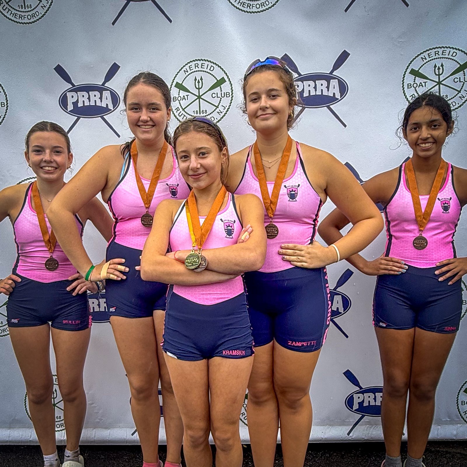 The Novice 4+ with their bronze medals