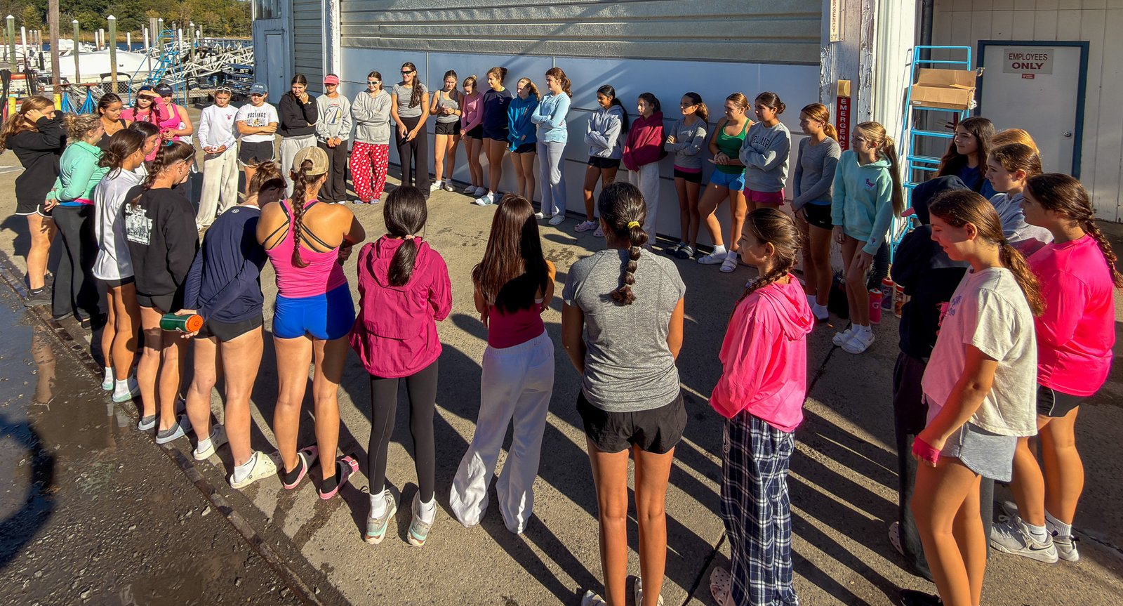The team lined up on the dock for the sister group reveal